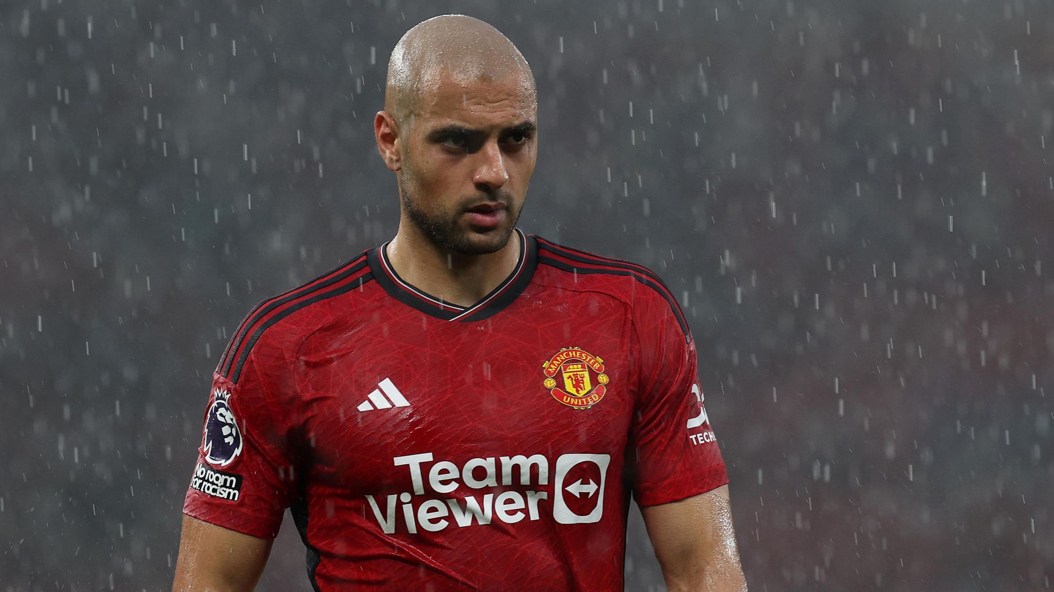 Sofyan Amrabat in action for Manchester United during heavy rain