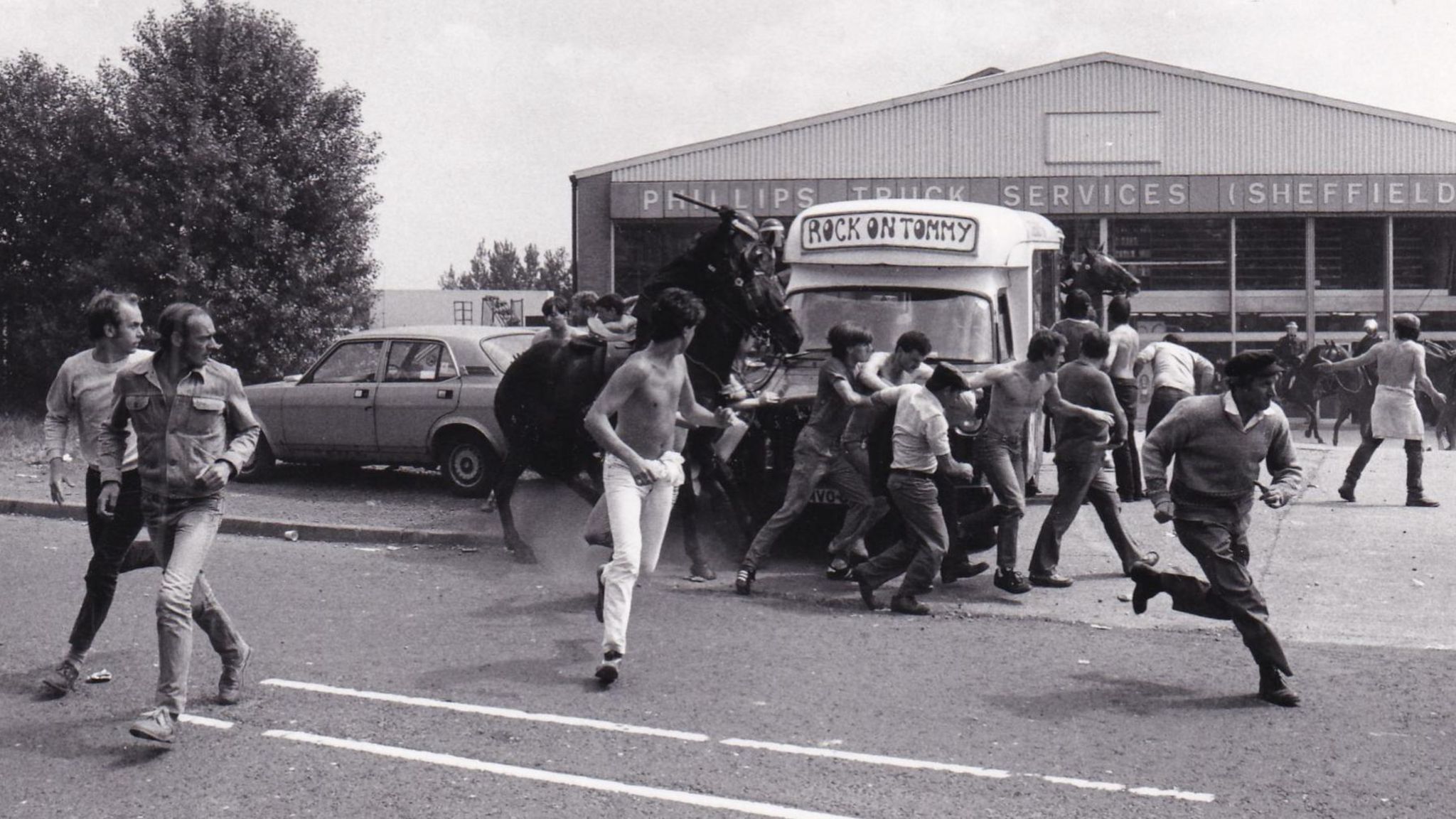 Mounted police charge picketers in Orgreave on 18 June 1984