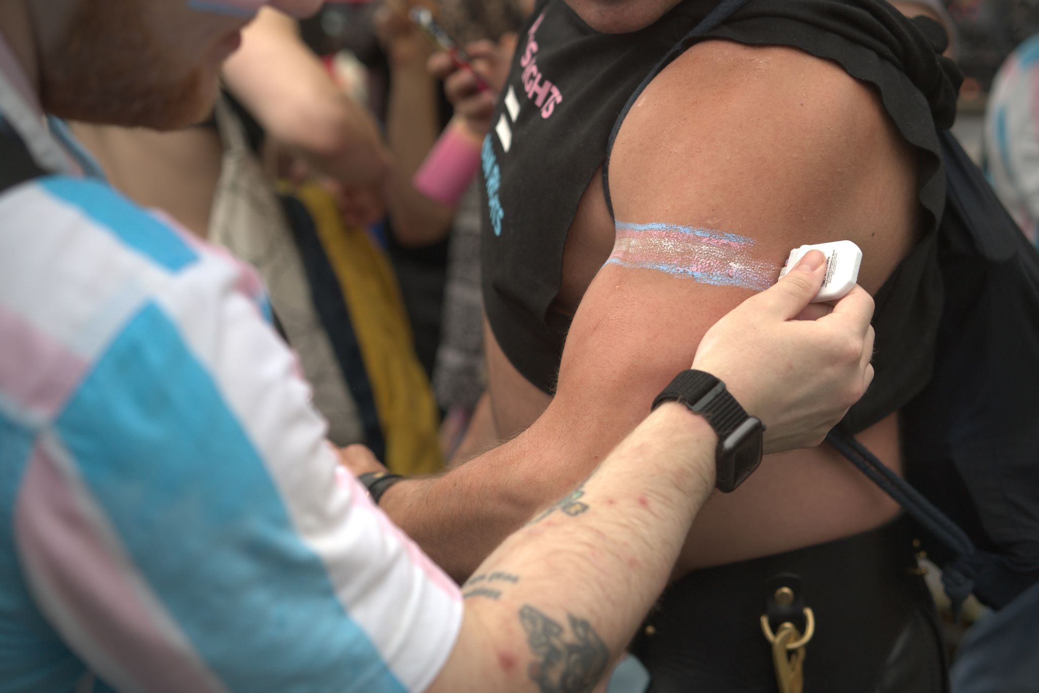 Someone paints trans flag on arm