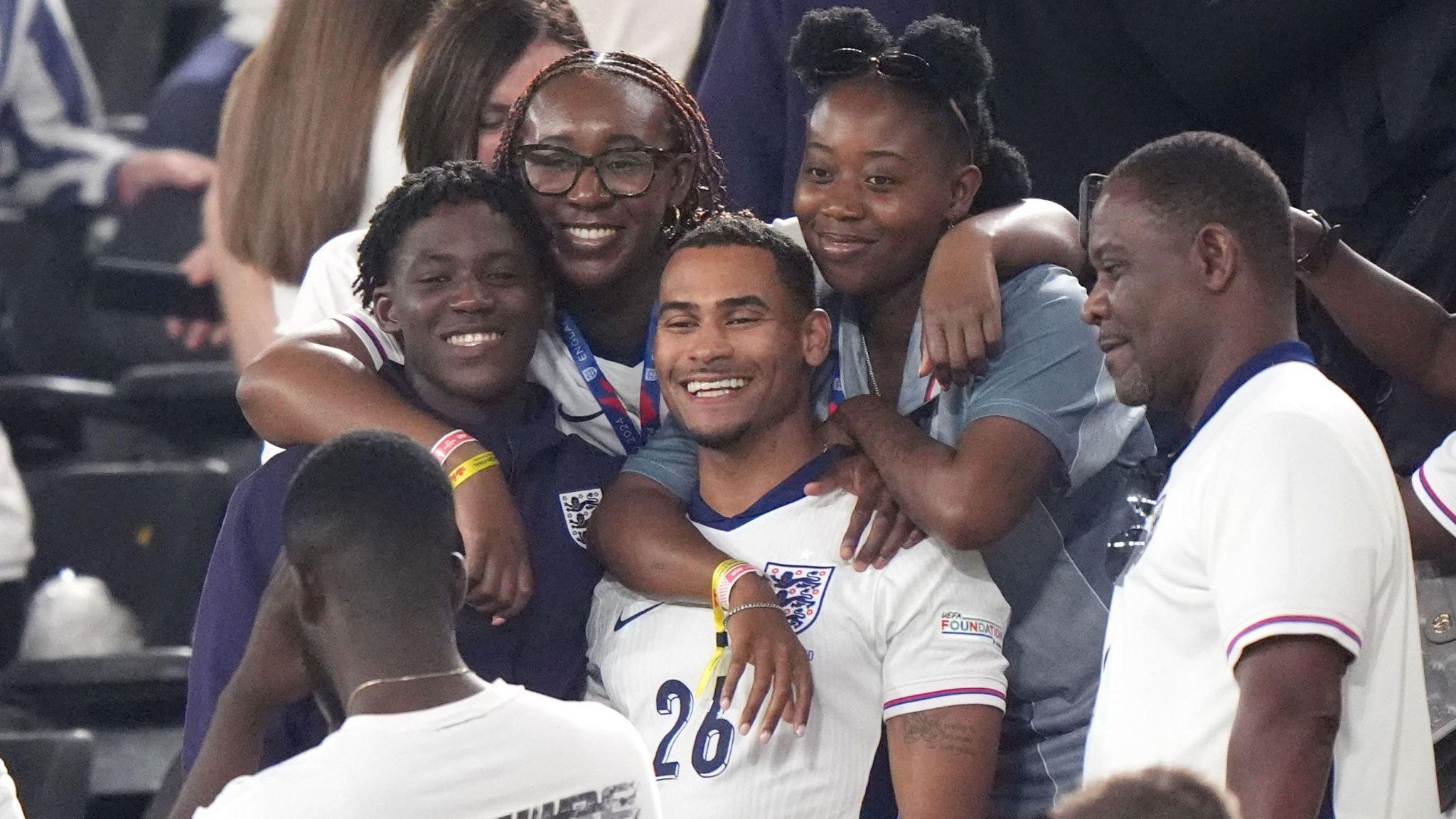 Kobbie Mainoo celebrates with his family after England's Euro 2024 semi-final win over the Netherlands