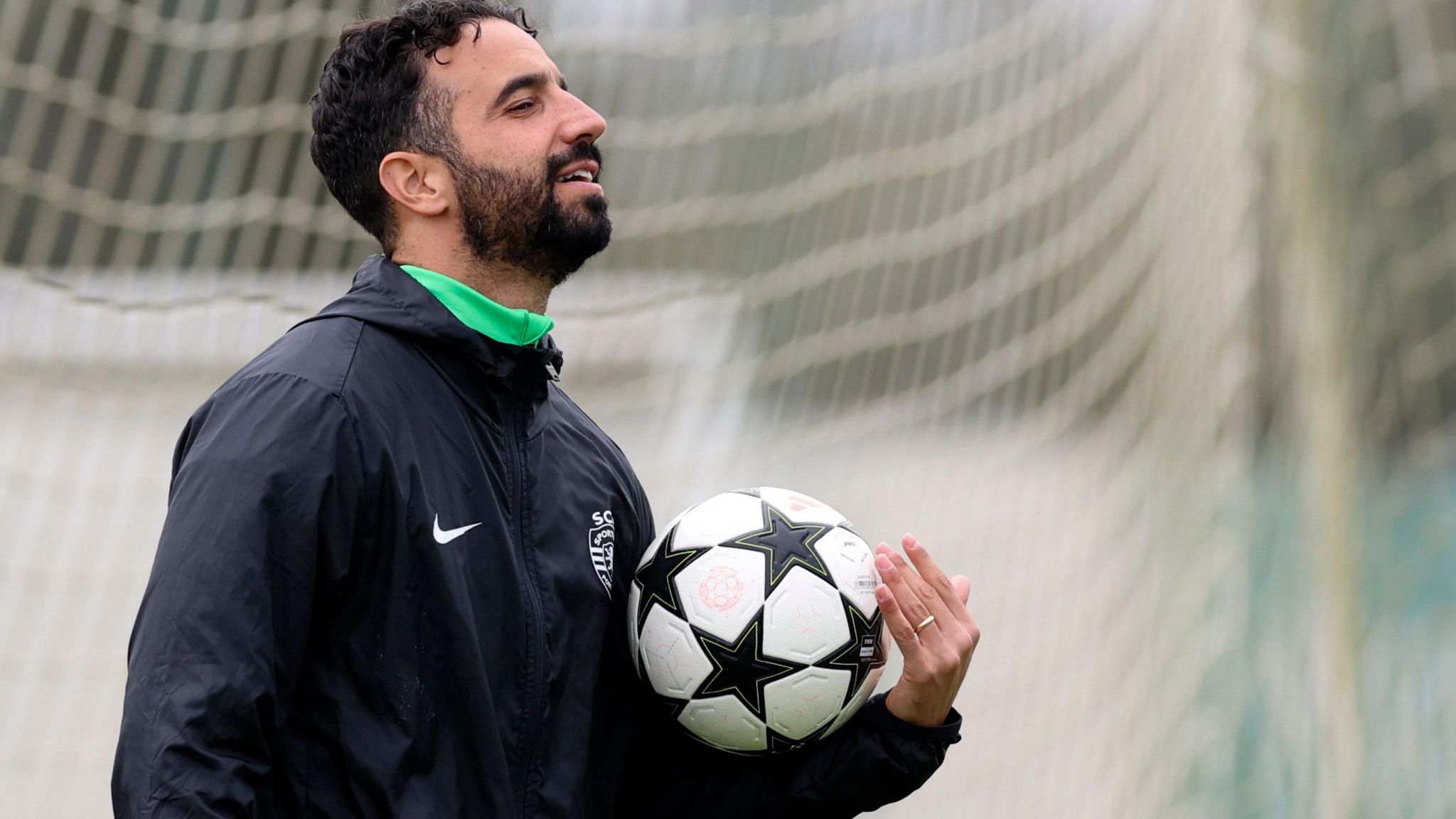 Ruben Amorim holds a football