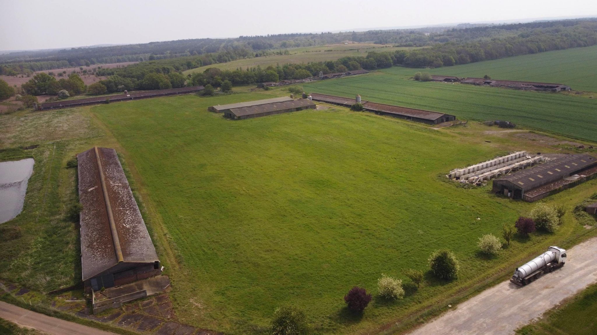 The site as it is now with old chicken sheds on the land