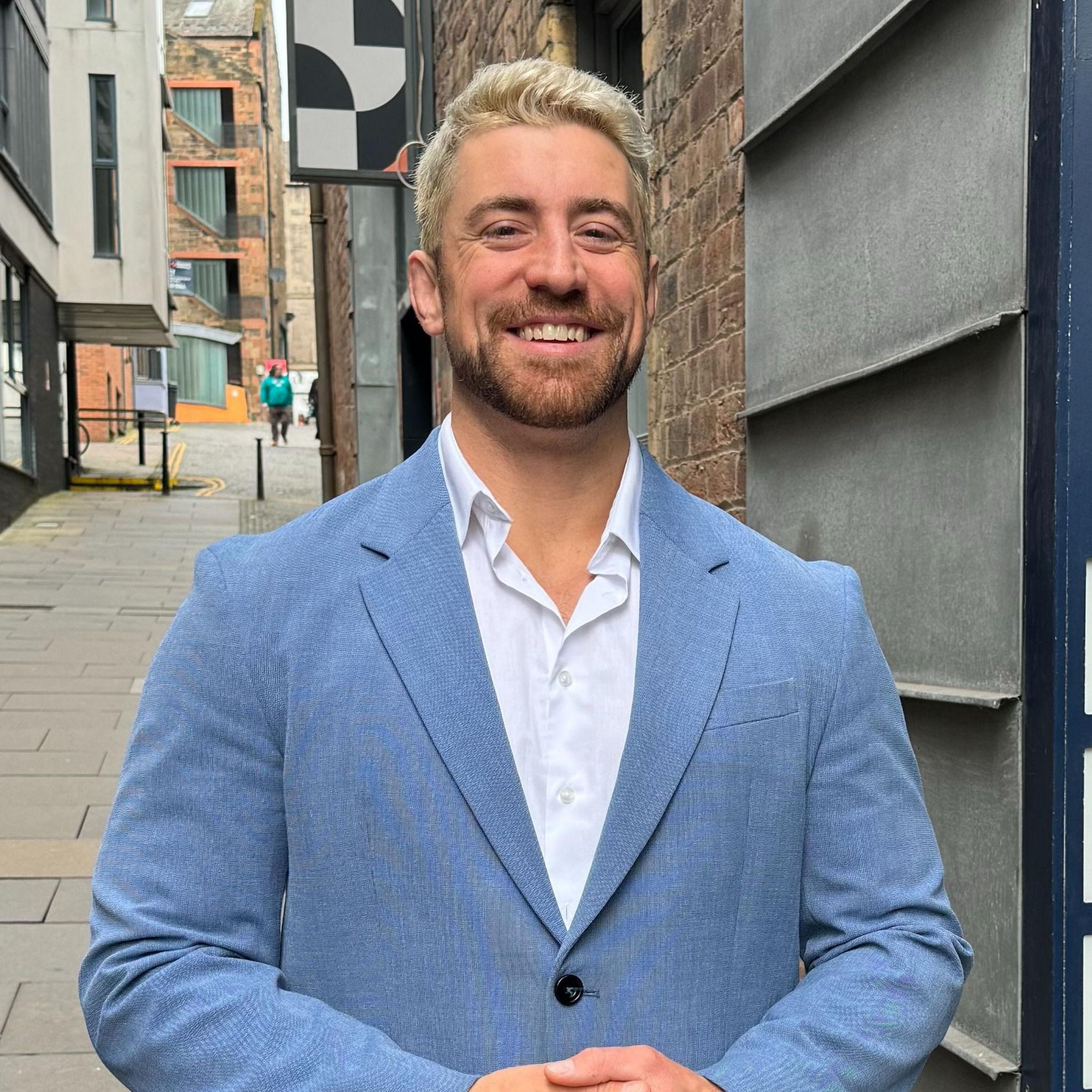 Wrestler Joe Hendry standing outside BBC building in Edinburgh