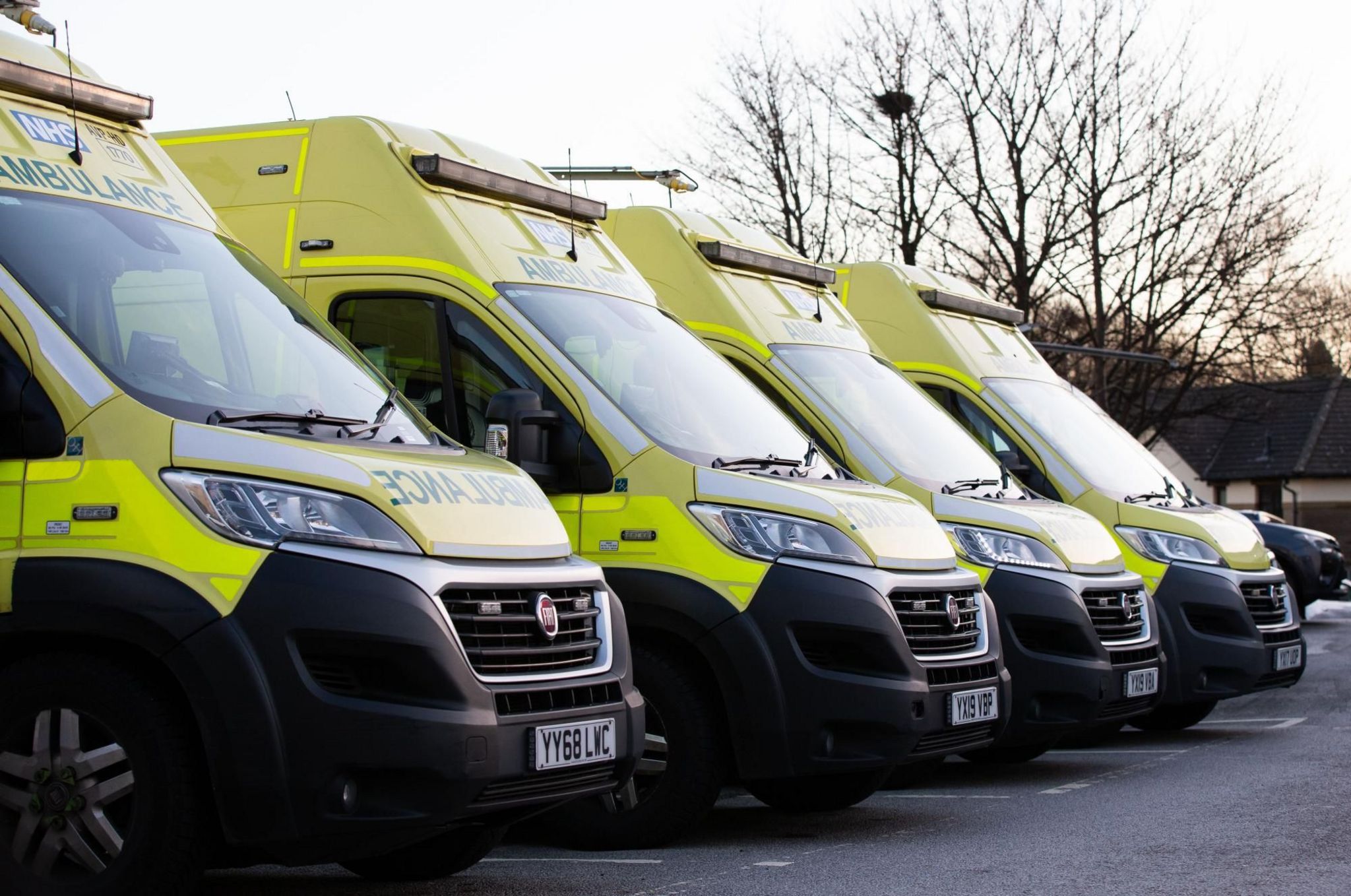 Four ambulances parked up at an ambulance station