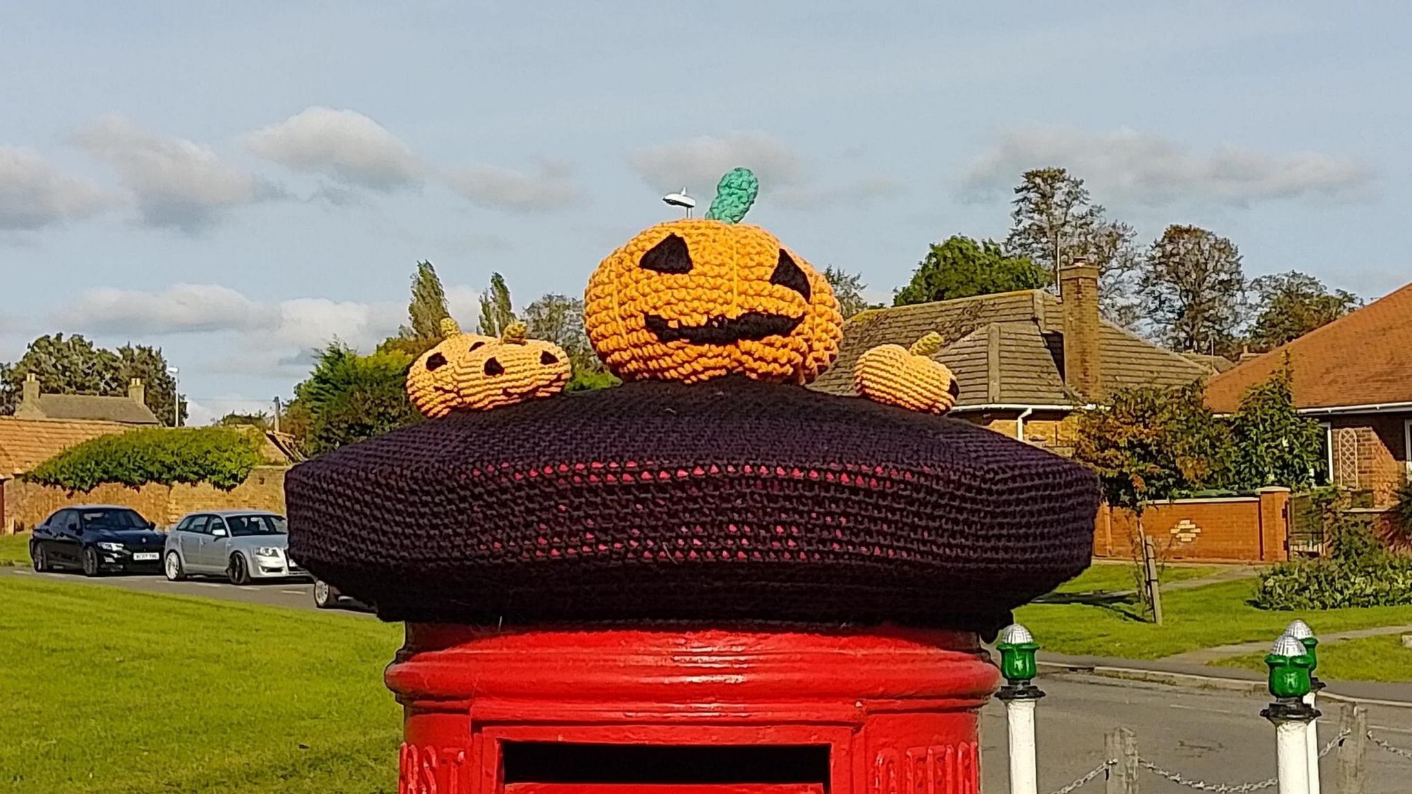 A knitted post-box topper 
