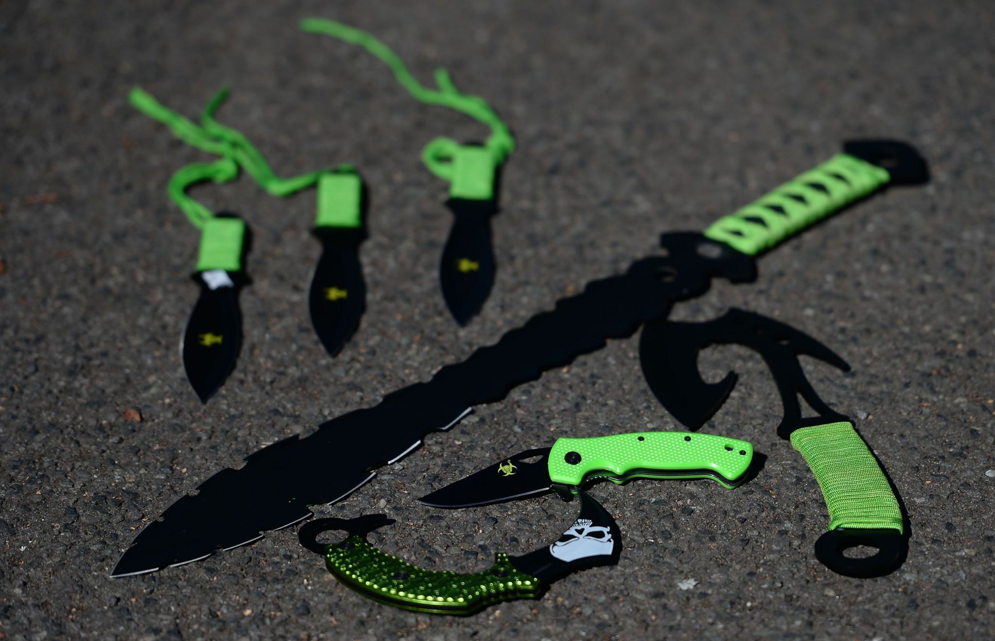 A selection of large knives with green handles