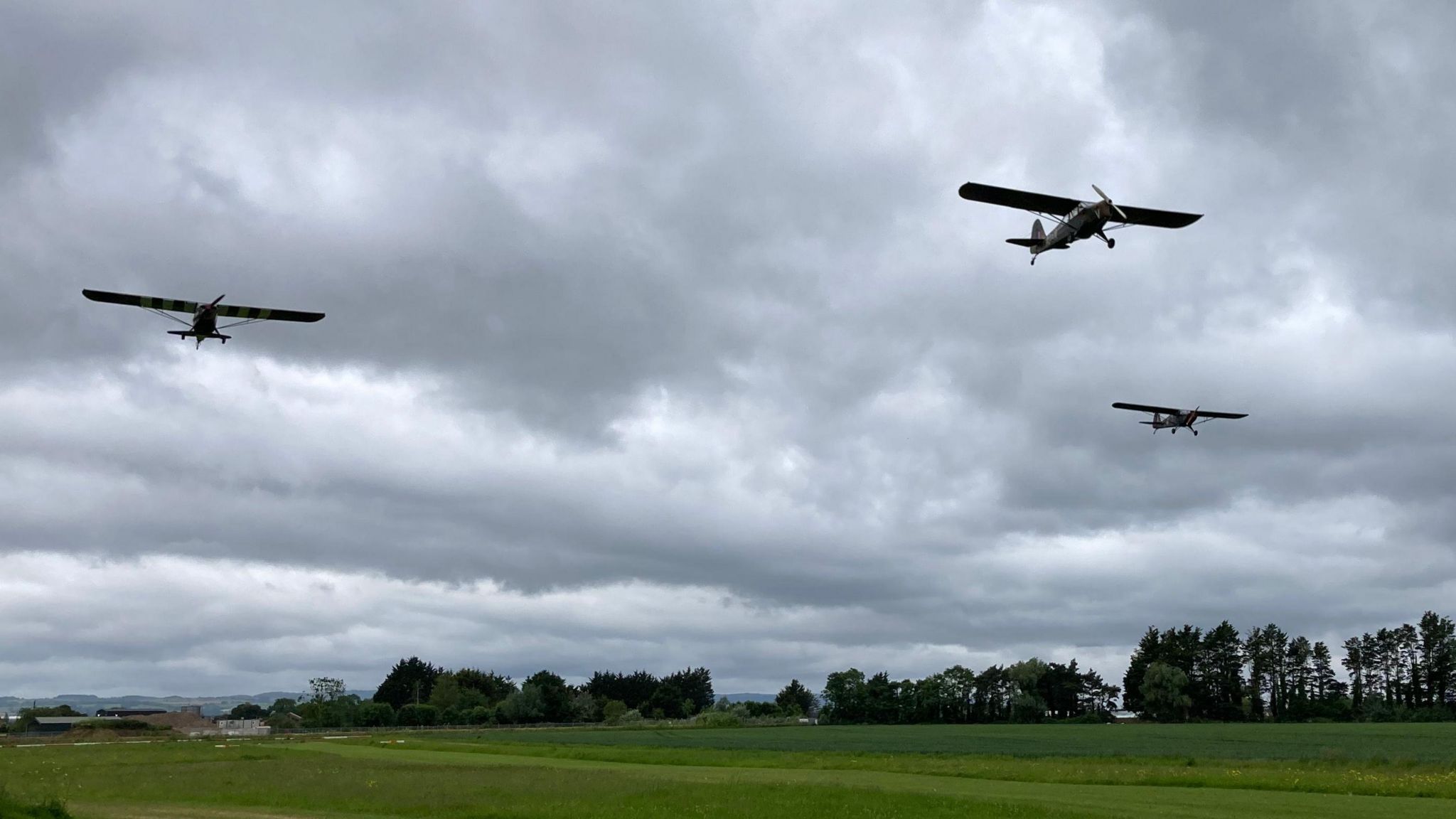 Planes in the sky above a field