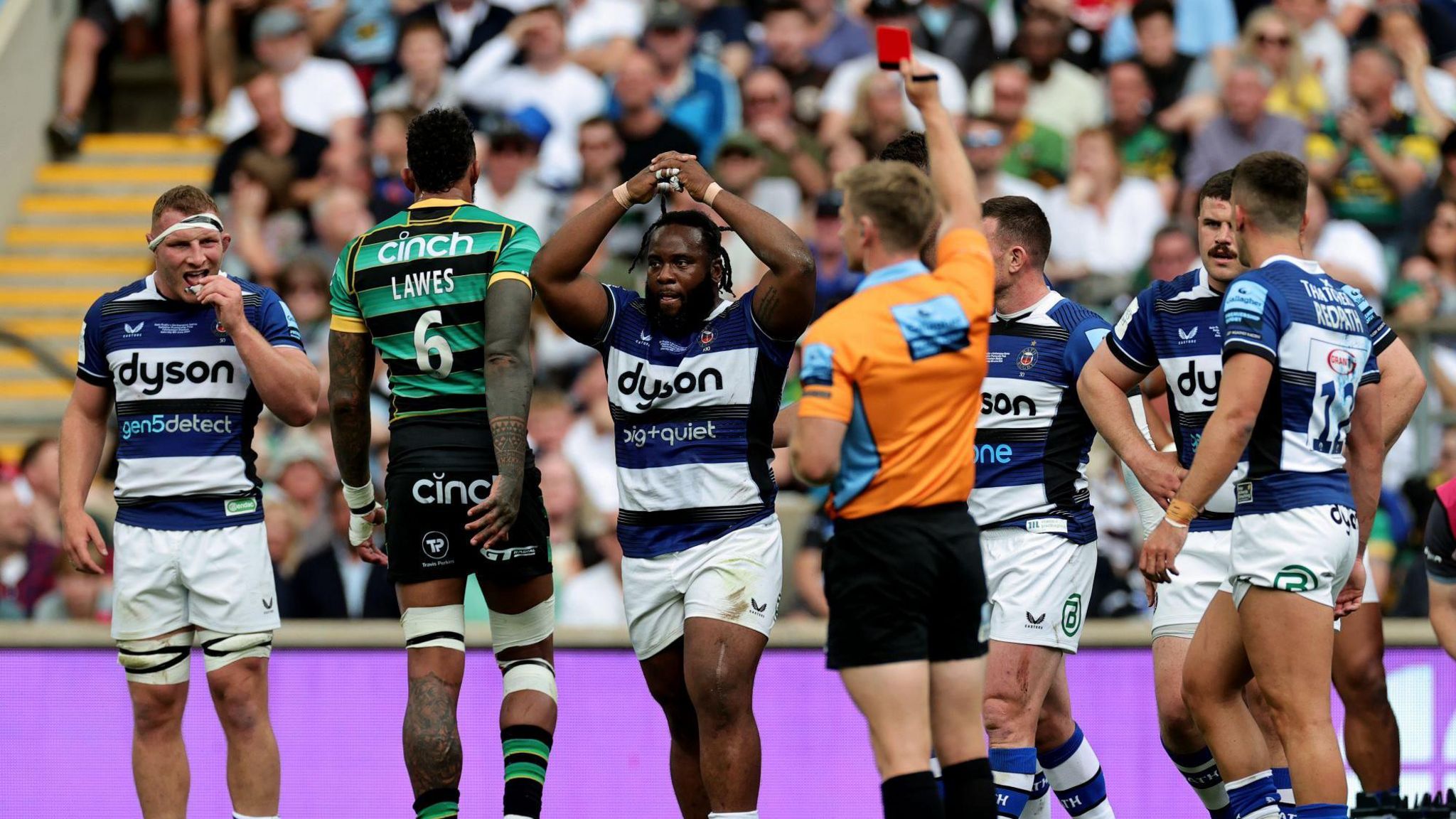 Beno Obano puts his hands on his head as he is shown a red card in the Premiership final