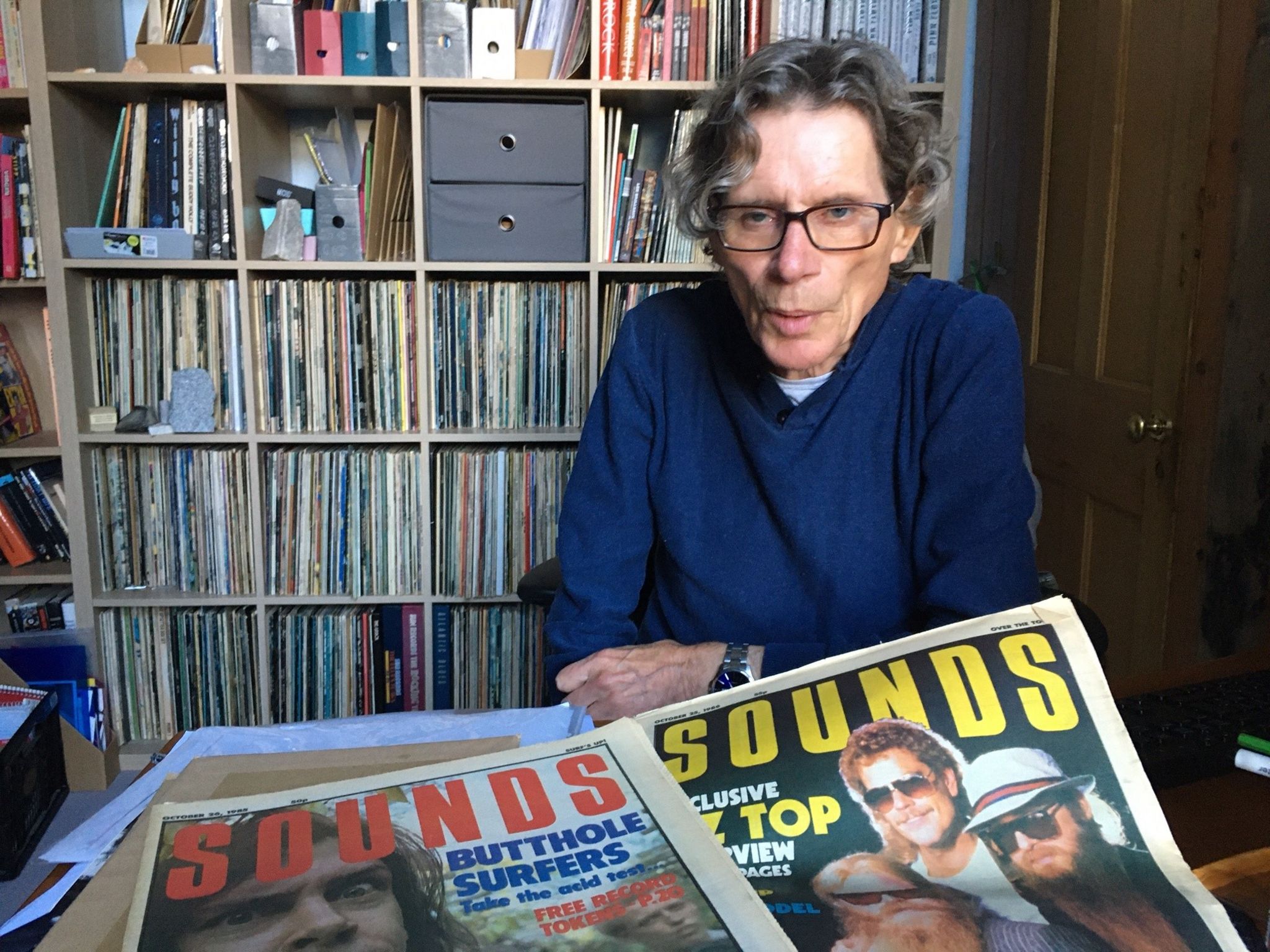 Hugh Fielder with copies of Sounds weekly music paper