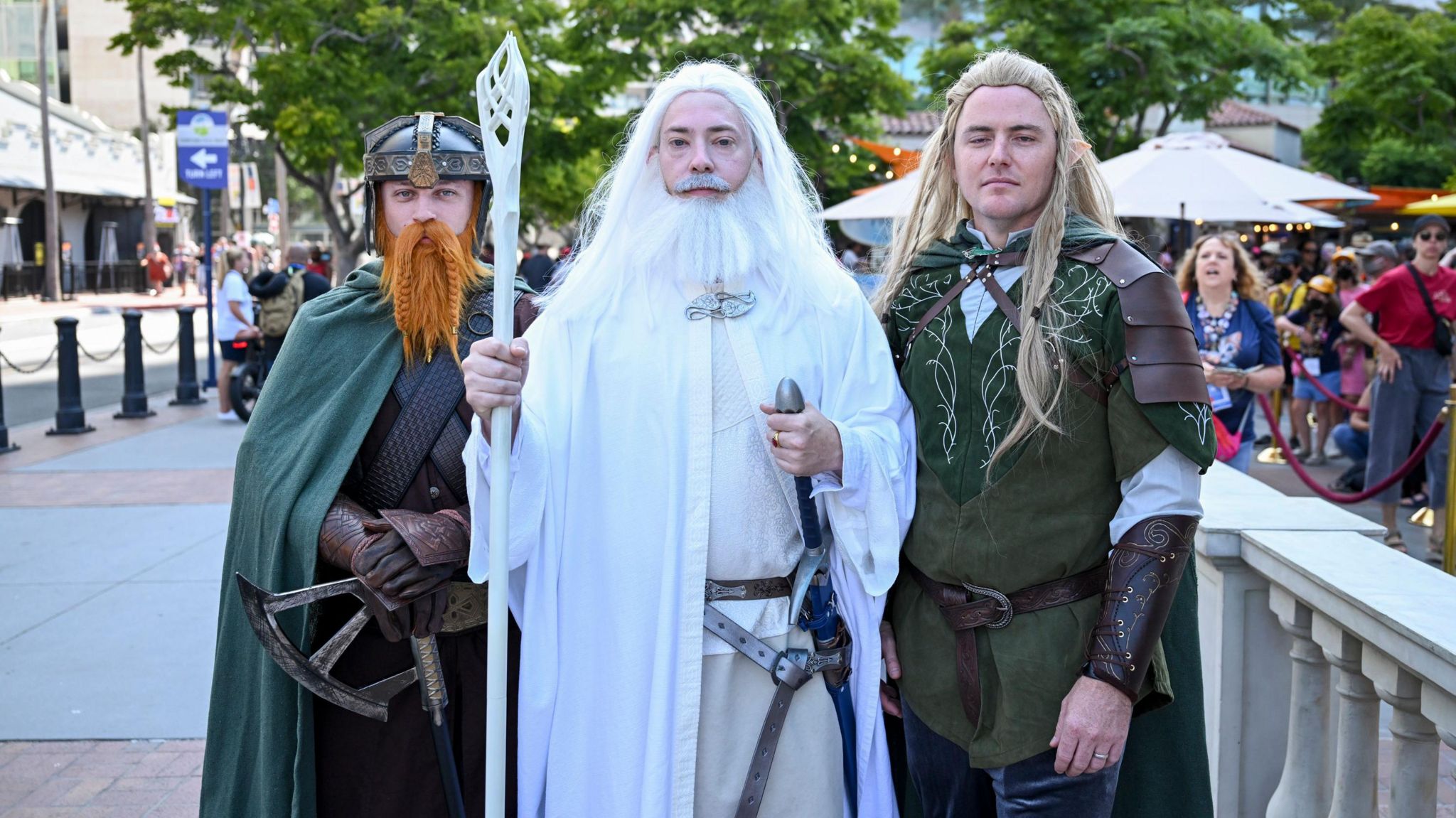 Cosplayers dressed as Gimli, Gandalf and Legolas from Lord of the Rings