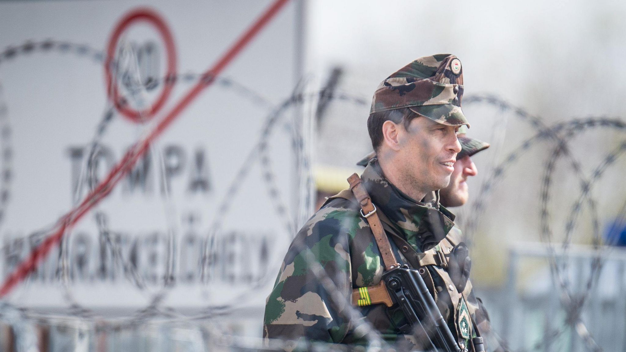 A Hungarian police officer patrols the border