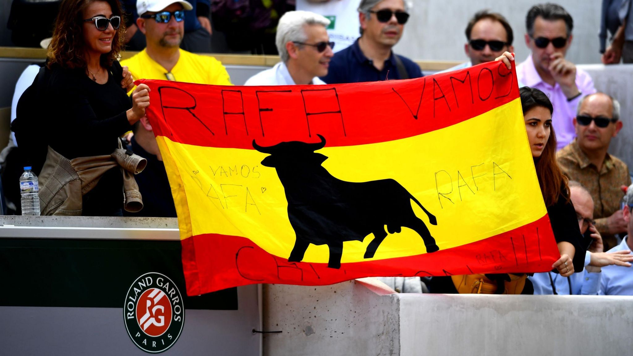 Rafael Nadal fans wave a Spanish flag at Roland Garros