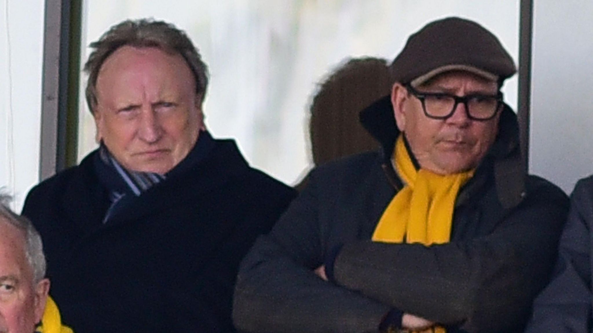Neil Warnock (left) and Michael Westcott (right) watch a Torquay game