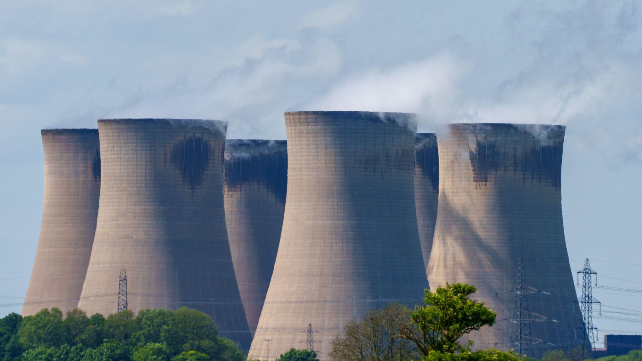 Drax Power Station near Selby. Pictured is six cooling towers behind a row of trees 