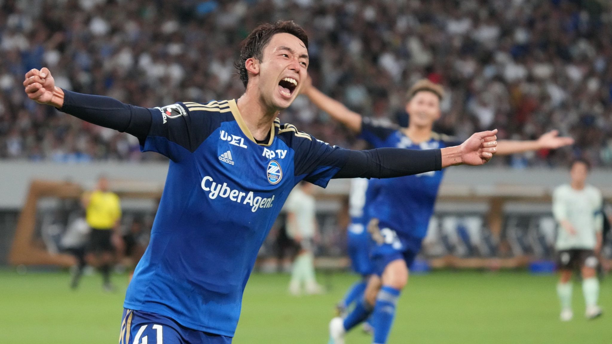 Machida Zelvia players celebrate