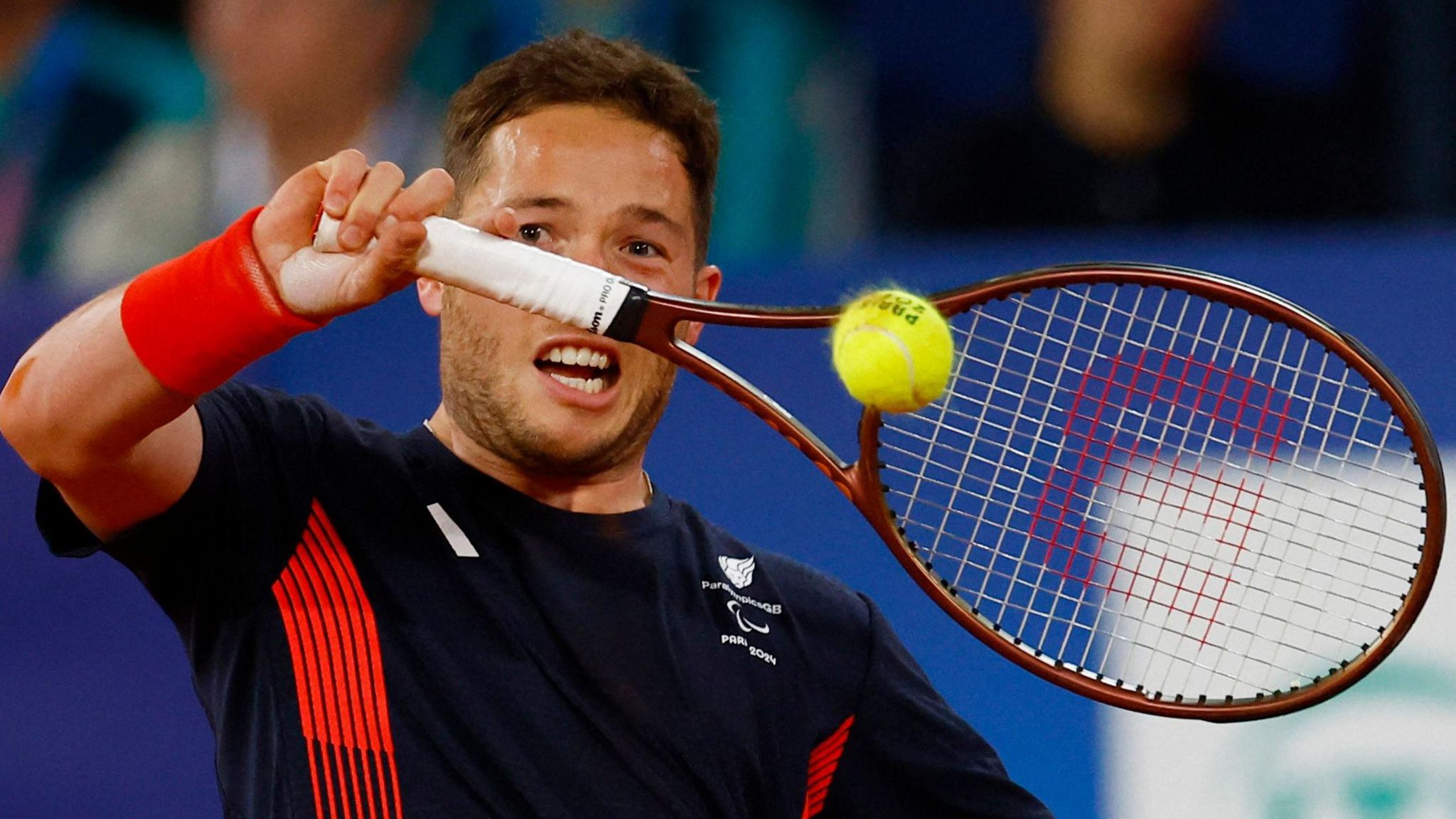 Alfie Hewett plays a backhand in the Paralympic gold-match medal