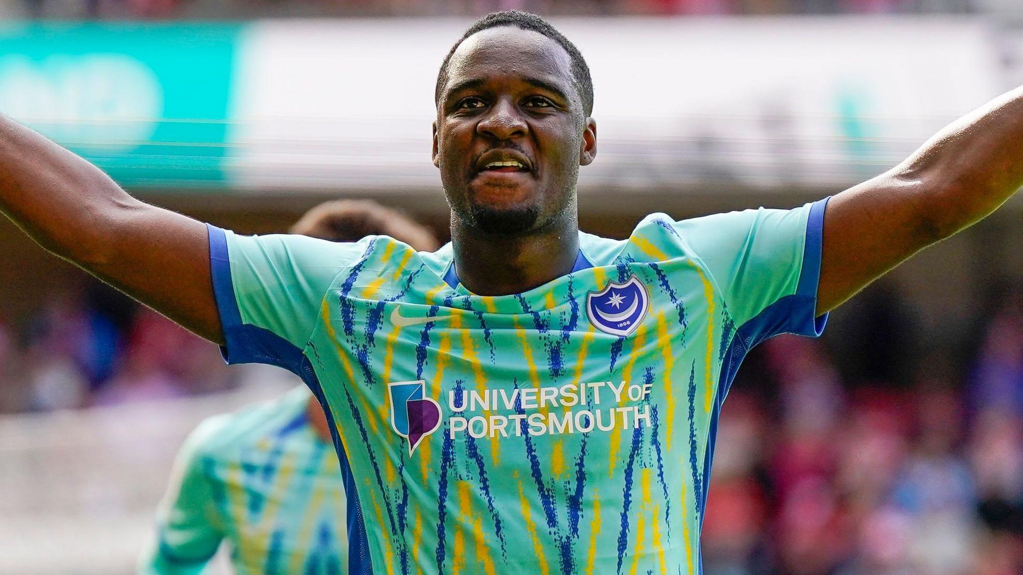 Christian Saydee celebrates scoring for Portsmouth