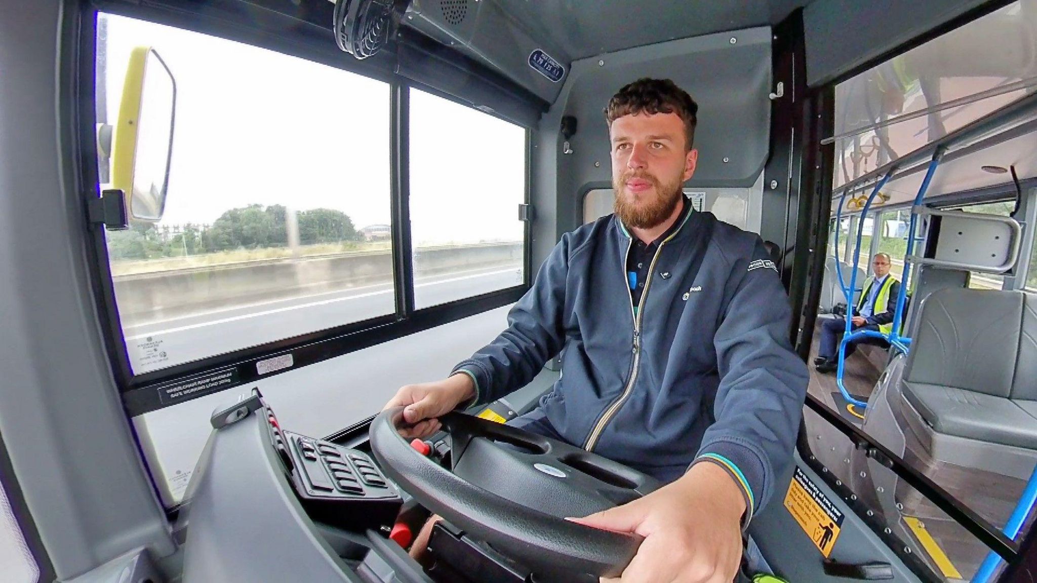 Jamie Watson at the wheel of the bus