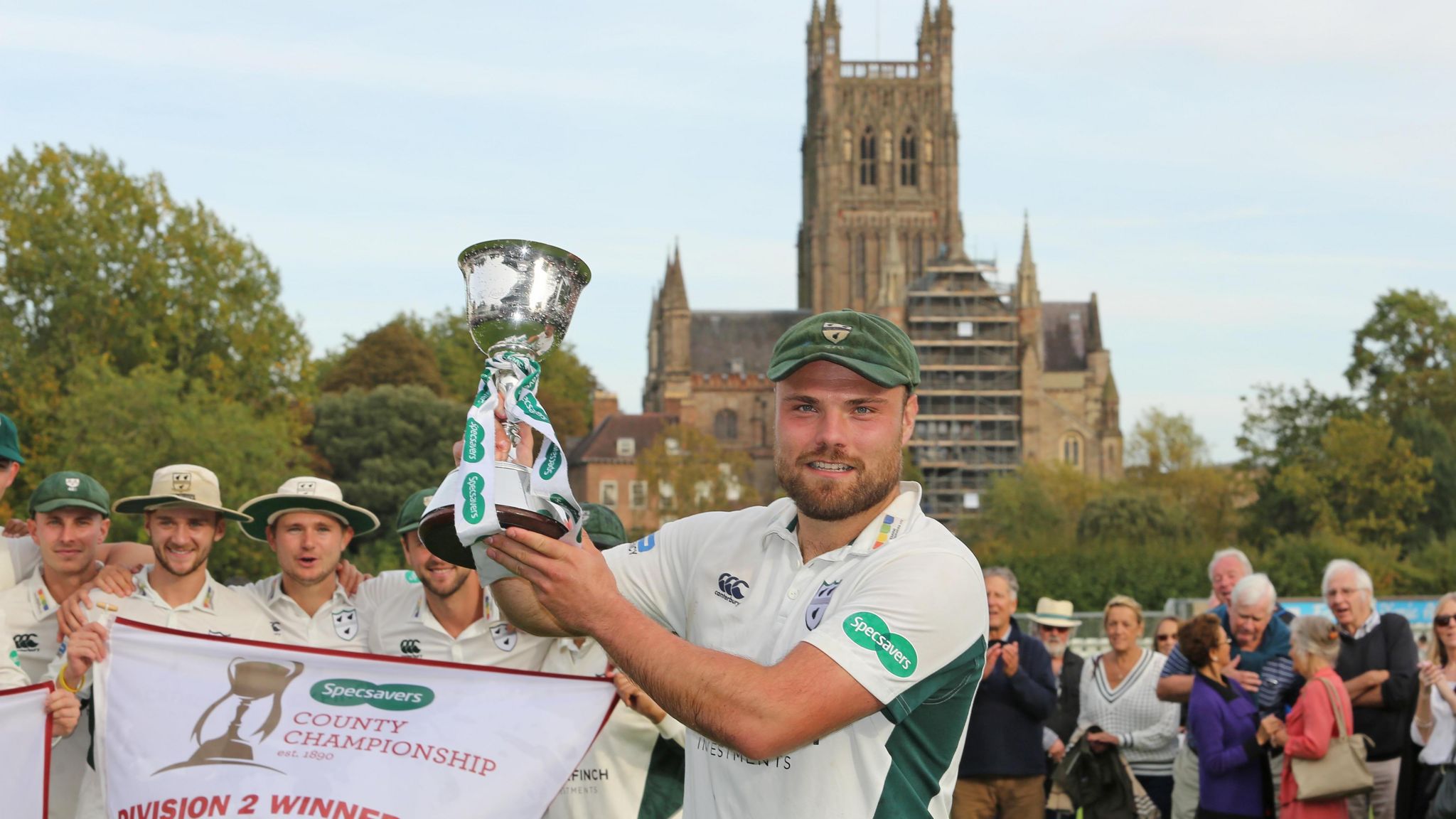 Joe Leach lifts the second division trophy after leading Worcestershire to promotion 