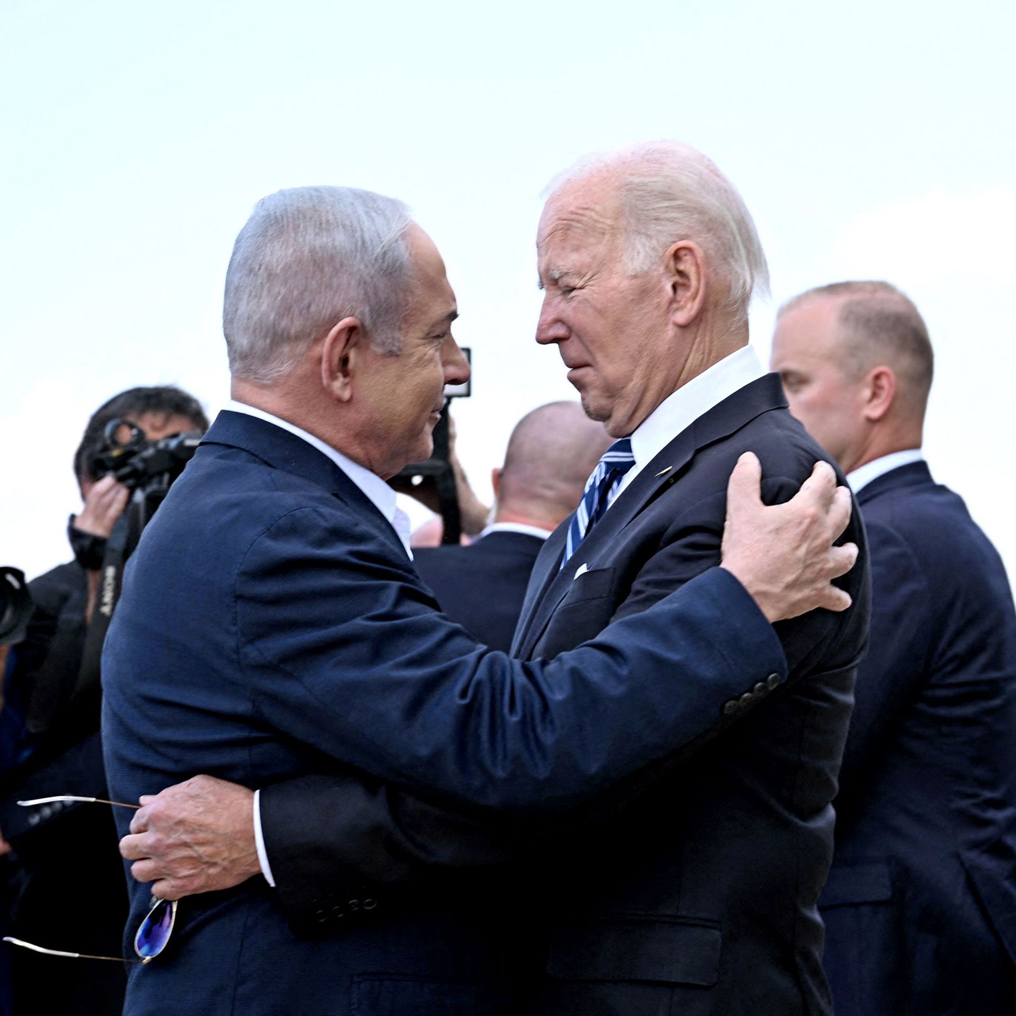 Israel Prime Minister Benjamin Netanyahu greets US President Joe Biden upon his arrival at Tel Aviv's Ben Gurion airport on 18 October 2023