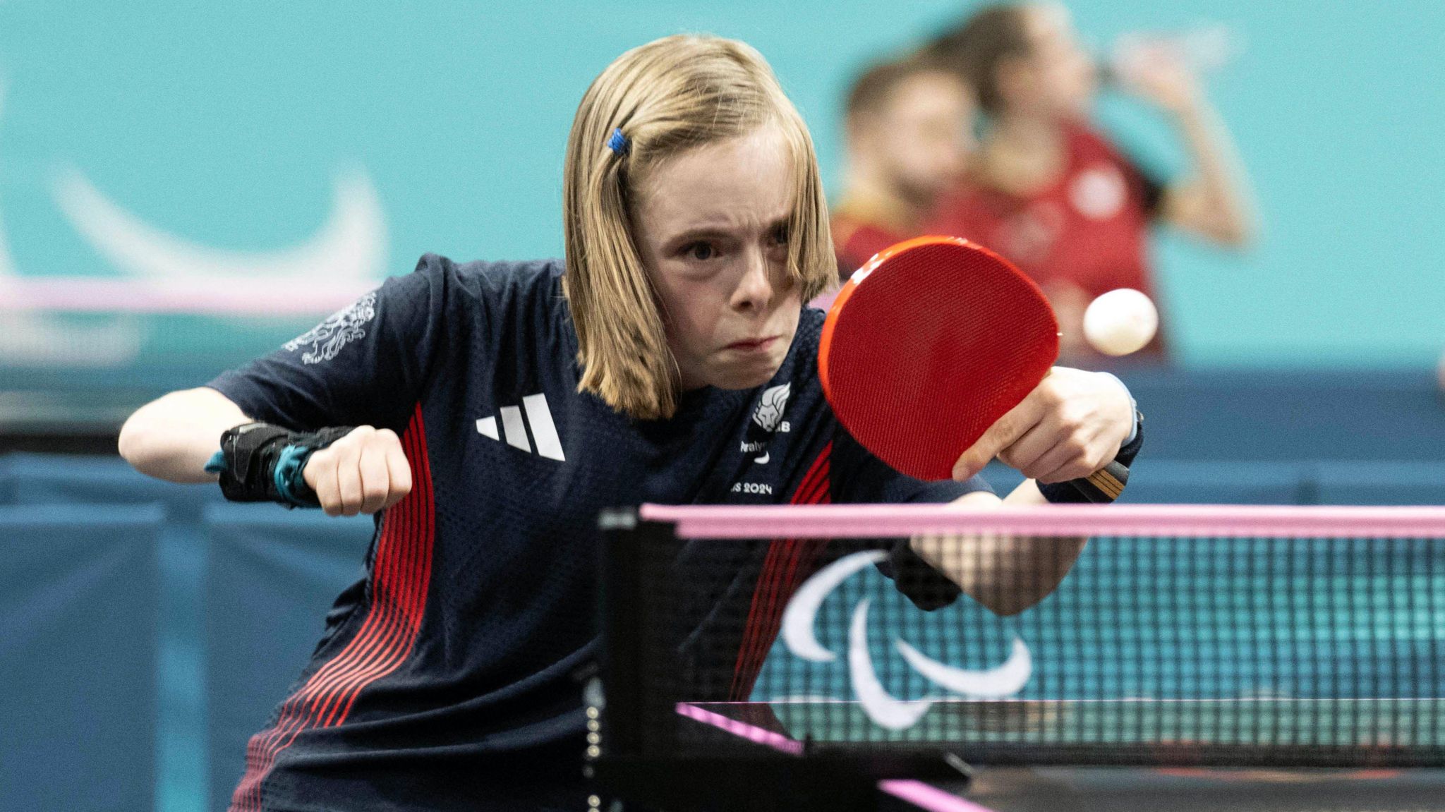 Bly Twomey winning Paralympic bronze at table tennis in Paris.