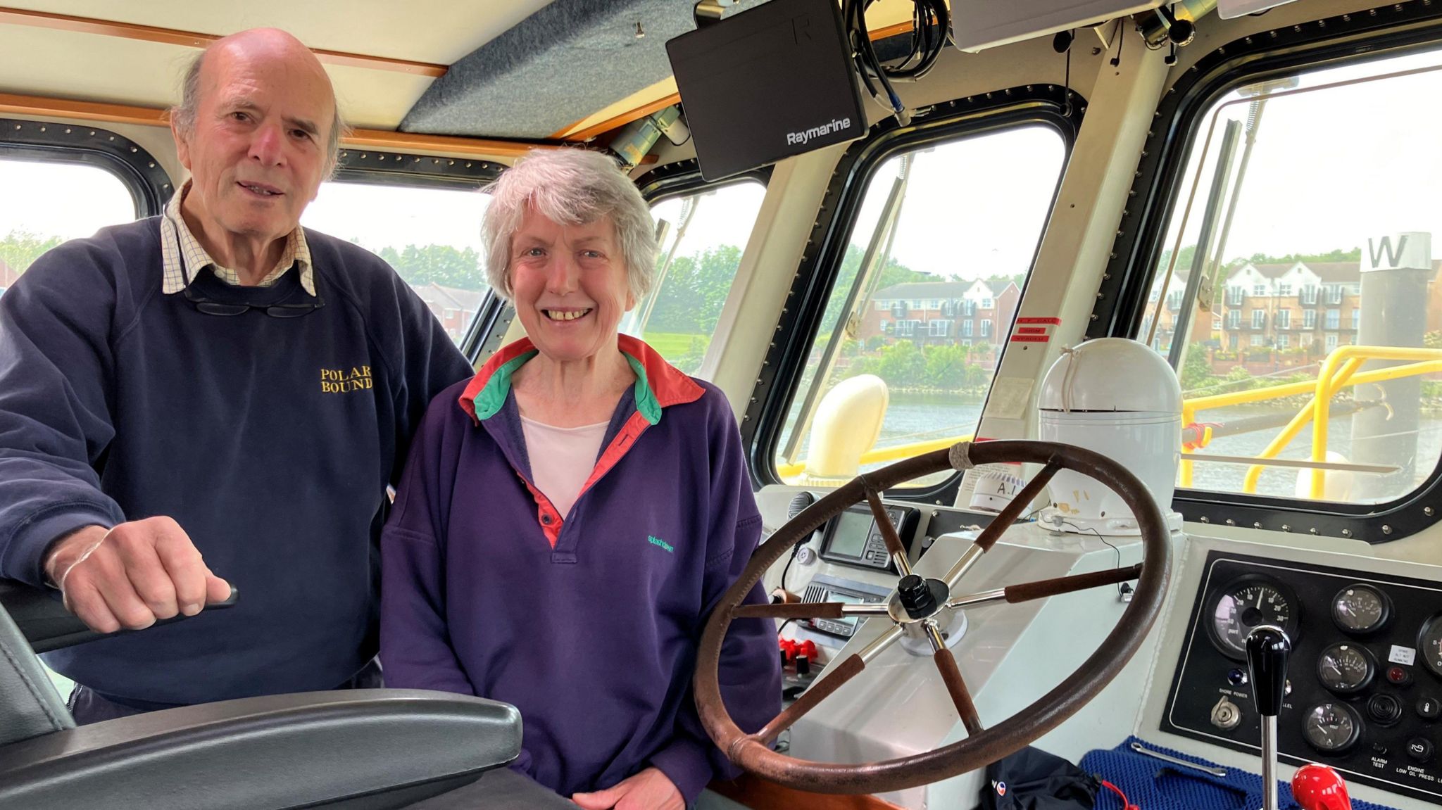 David Cowper and Susannah Broome standing in the wheelhouse of Polar Bound