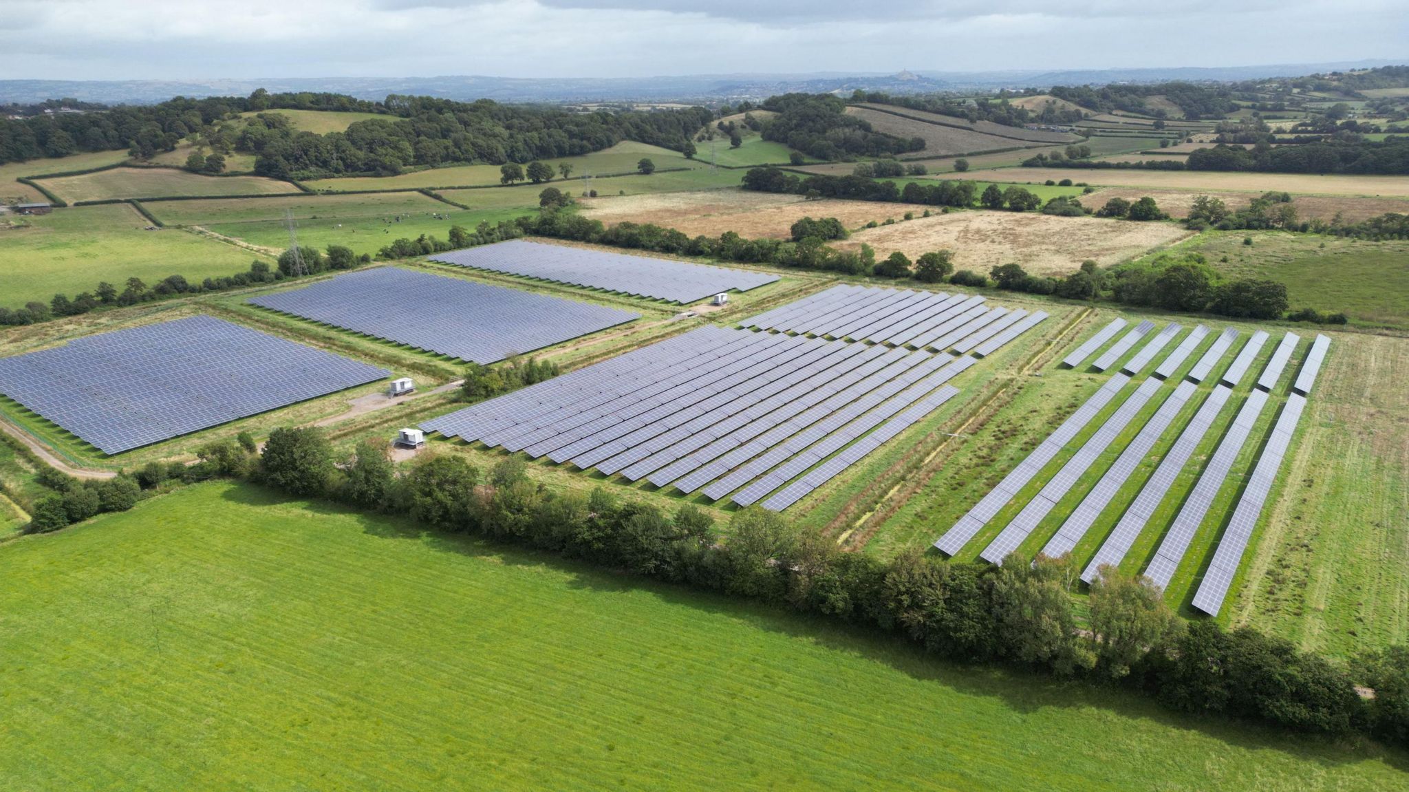 Fields covered in solar panels near Pedwell, Somerset, seen from the air