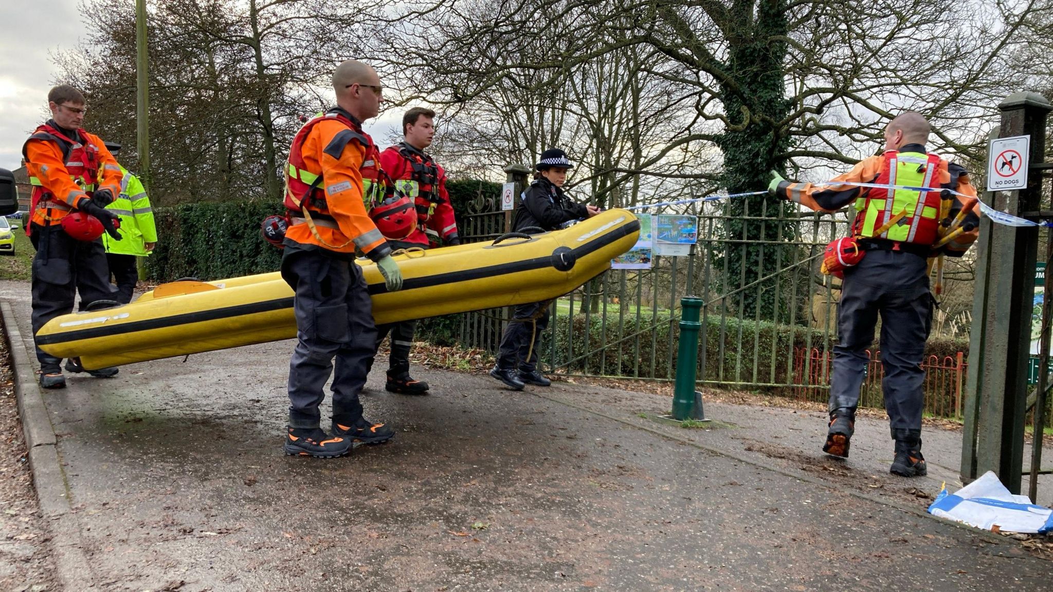 Search teams carrying a boat