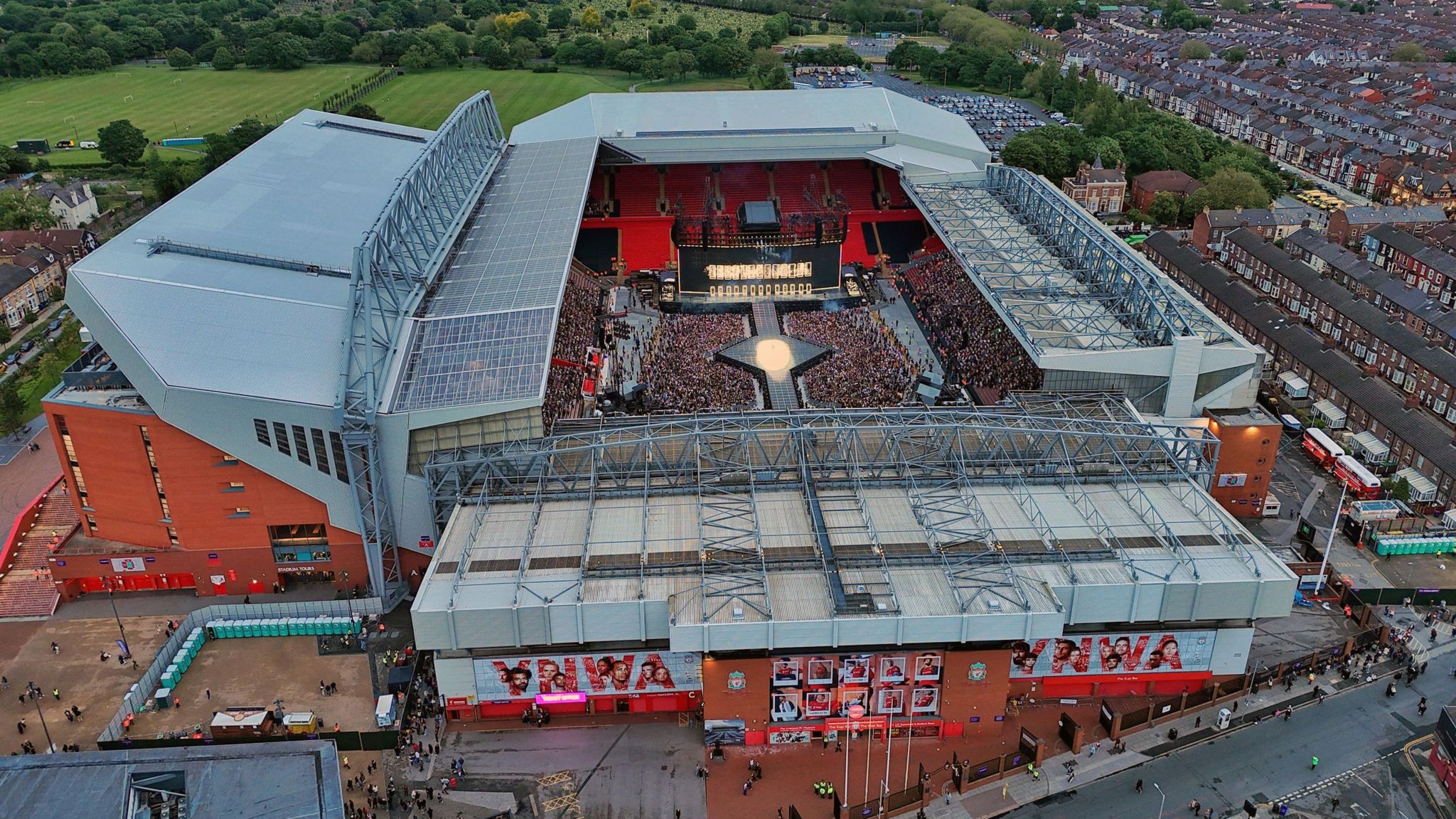 Anfield Stadium, Liverpool with Taylor Swift crowds, an aerial shot