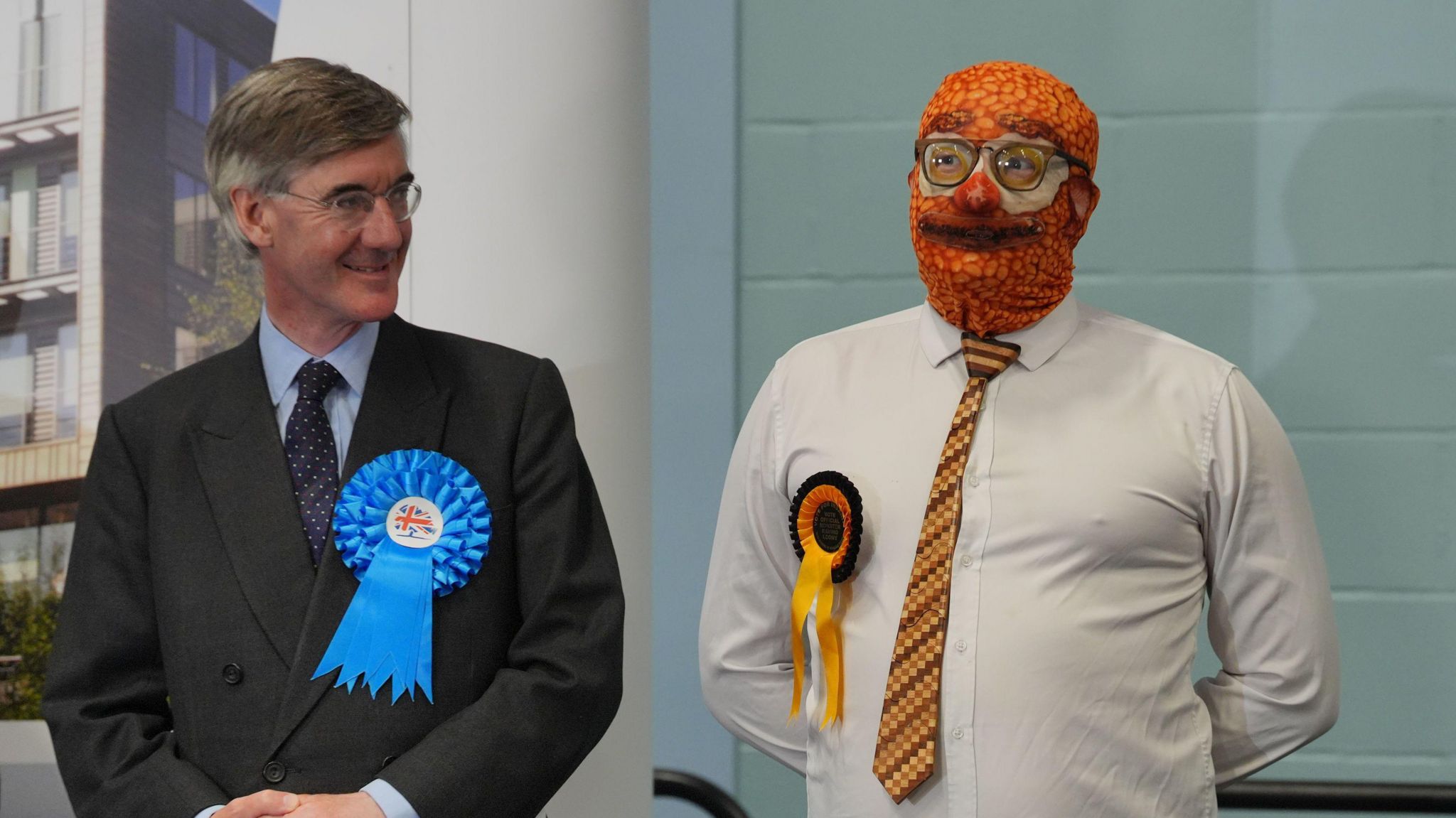 Sir Jacob Rees-Mogg stood next to man with bake beans face mask on at election count.