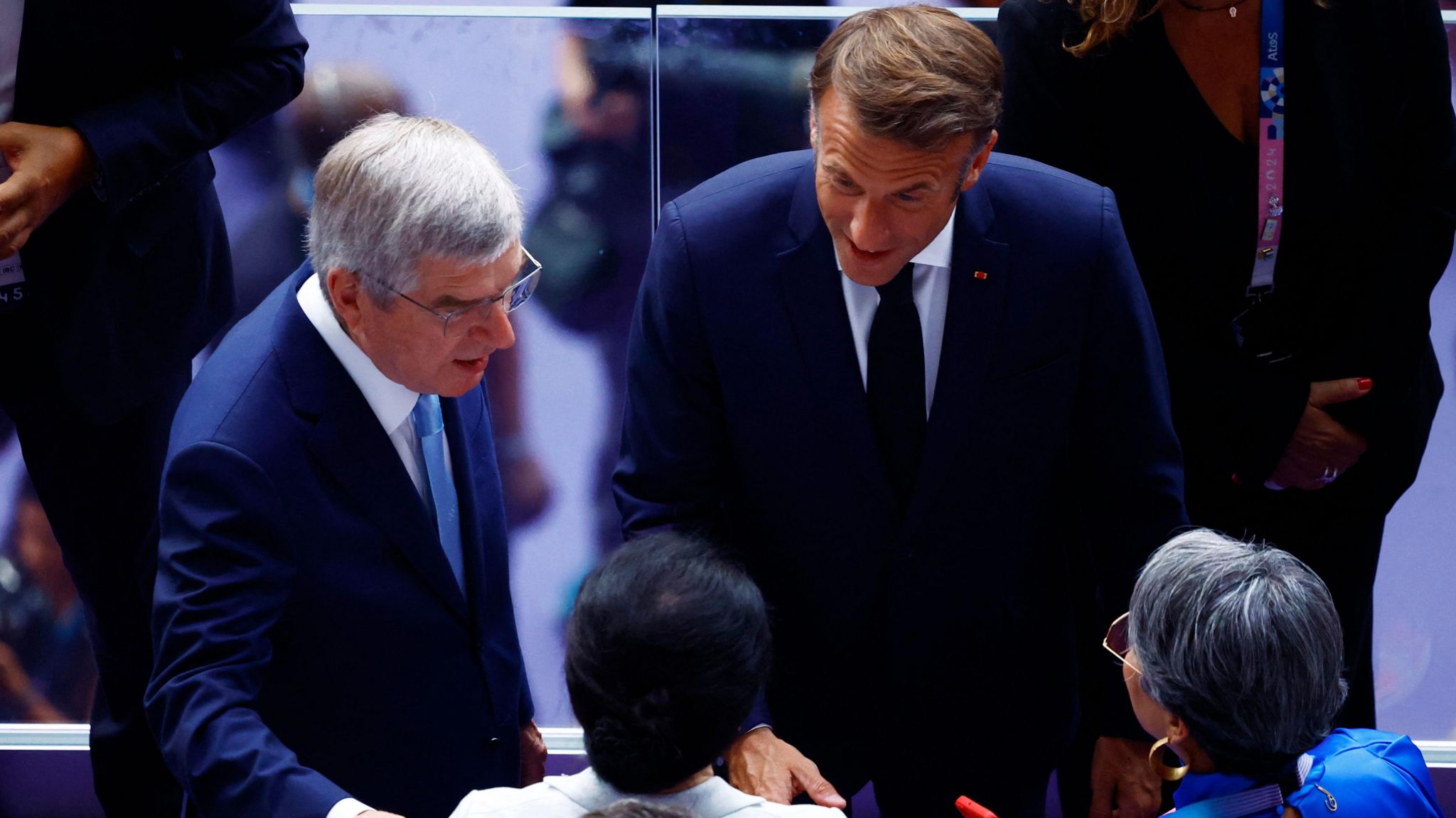 IOC president Thomas Bach and Emmanuel Macron, president of France, arrive at the closing ceremony