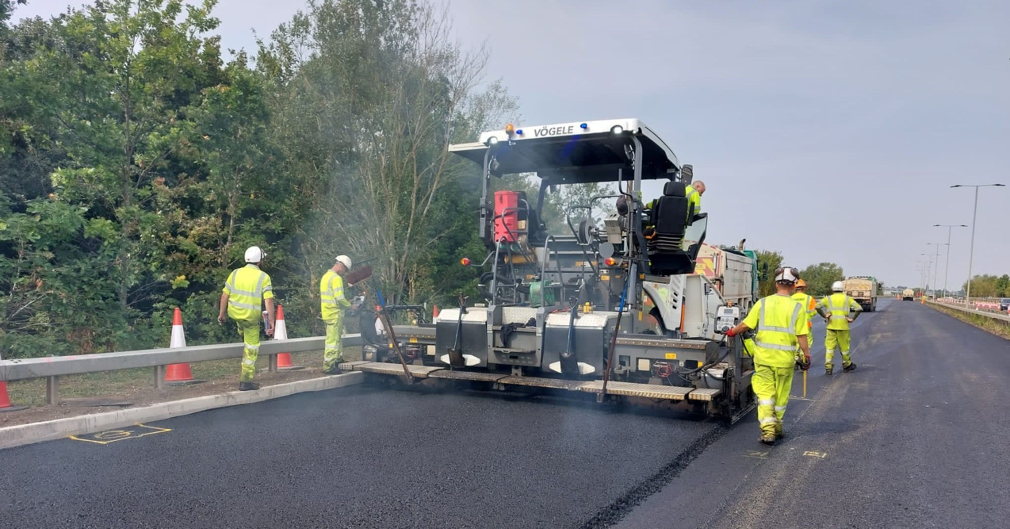 Workers carrying out road resurfacing work on the A6 by Bedford