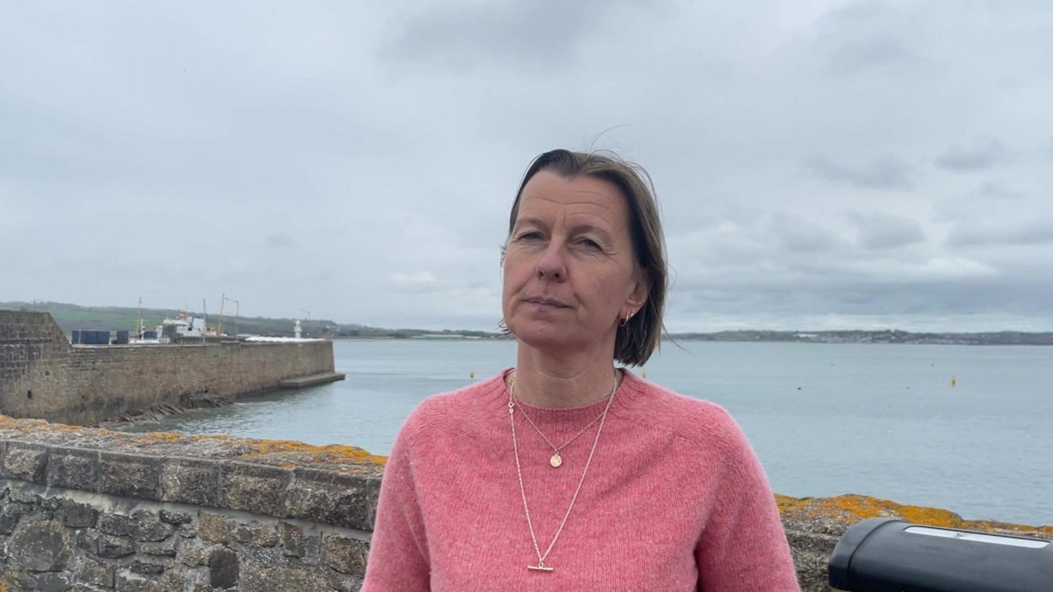 Woman standing by pier