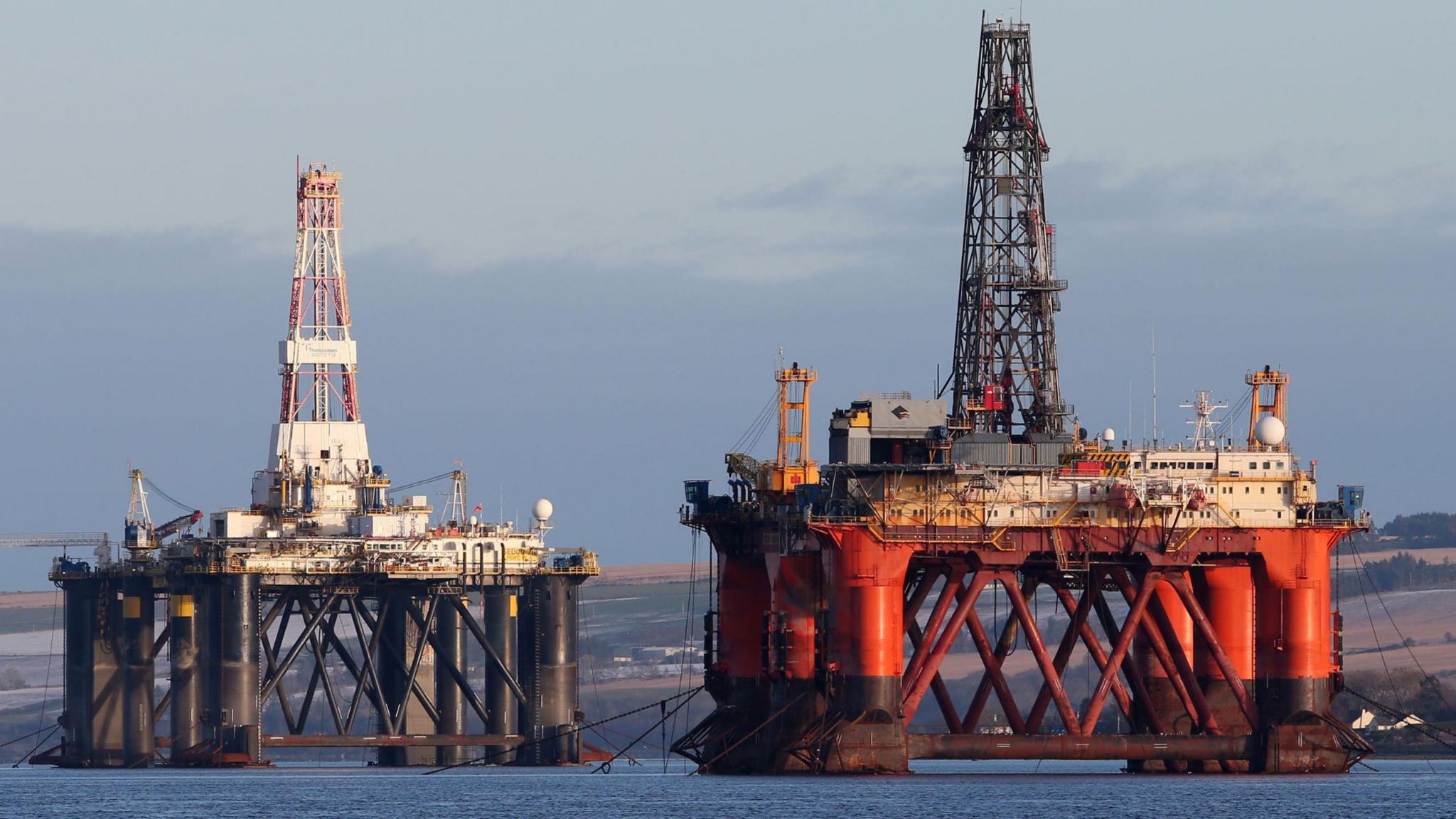 Oil platform standing amongst other rigs that have been left in the Cromarty Firth near Invergordon in the Highlands of Scotland