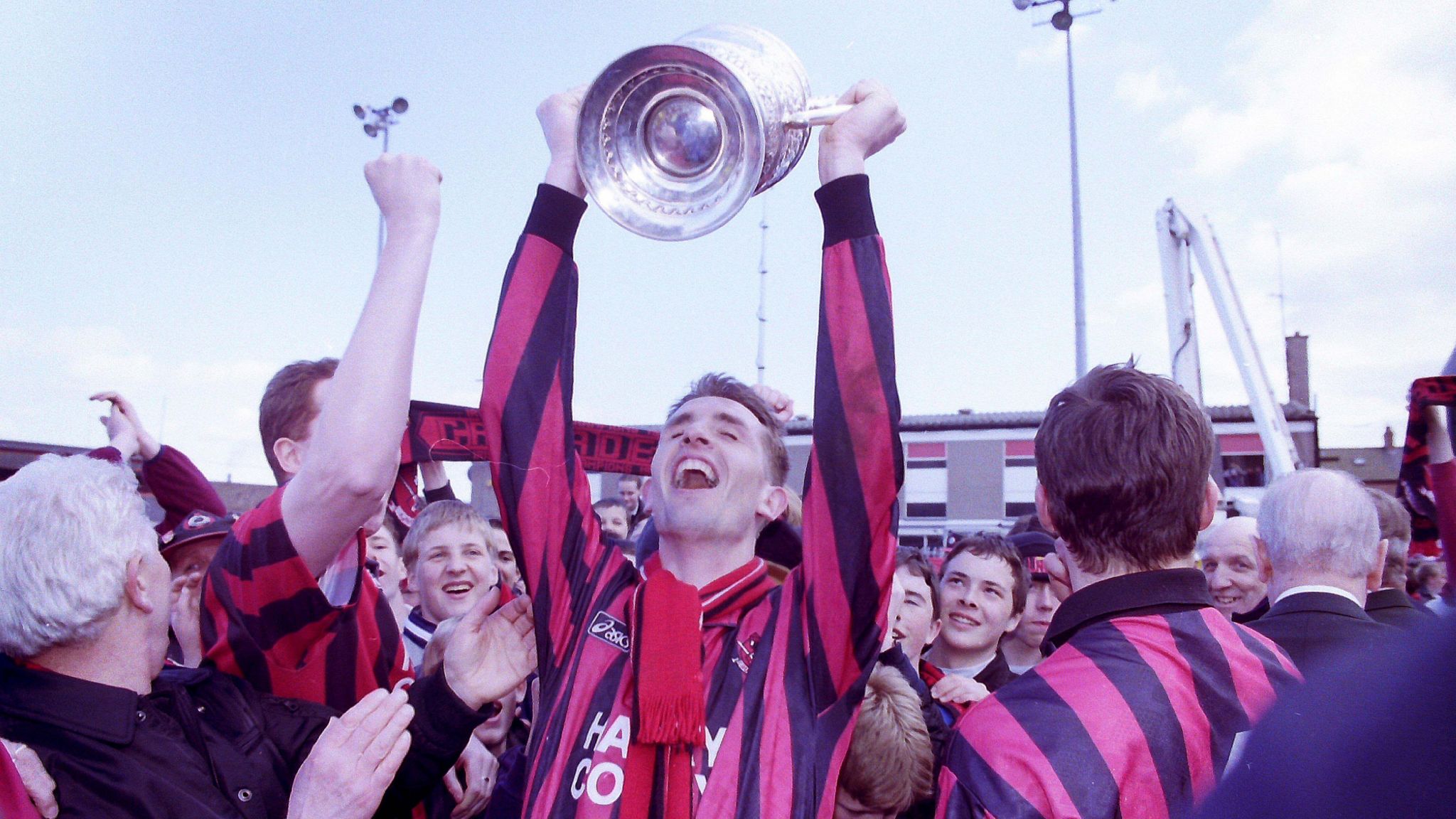 Crusaders' Stephen Baxter lifts the Gibson Cup in 1997