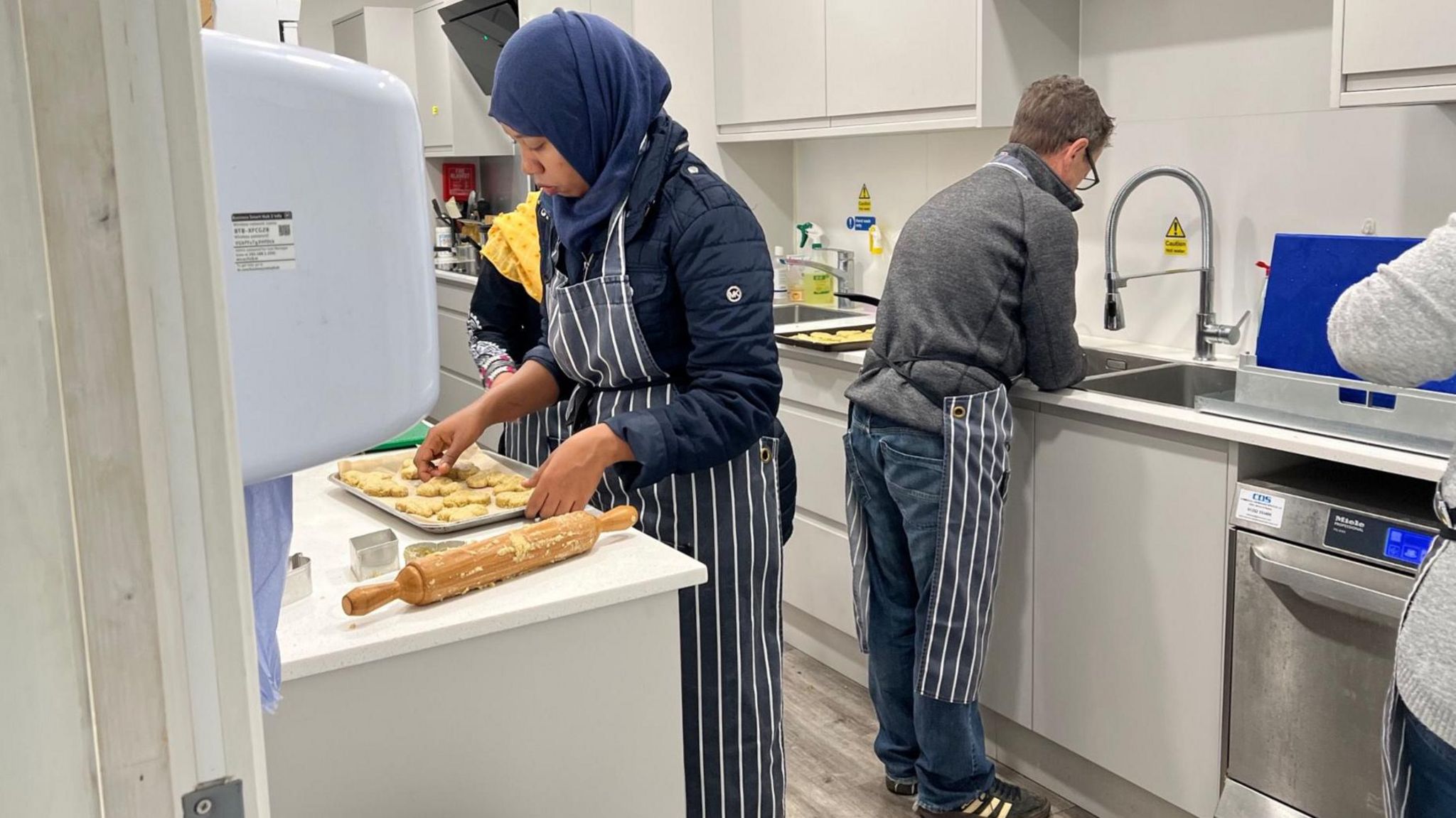 Asylum seekers cooking traditional dishes from their home countries