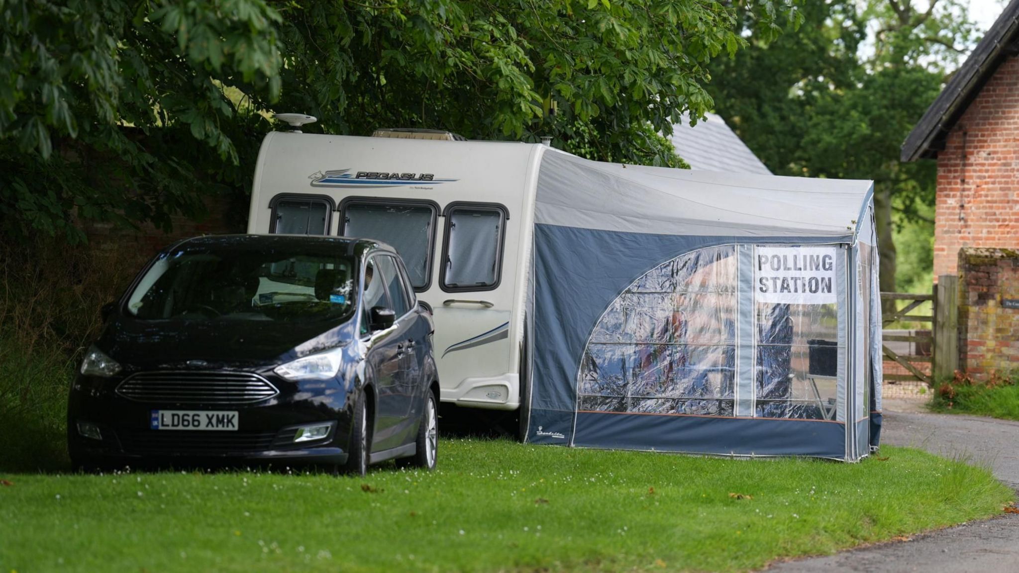 A caravan and tent being used as a polling station