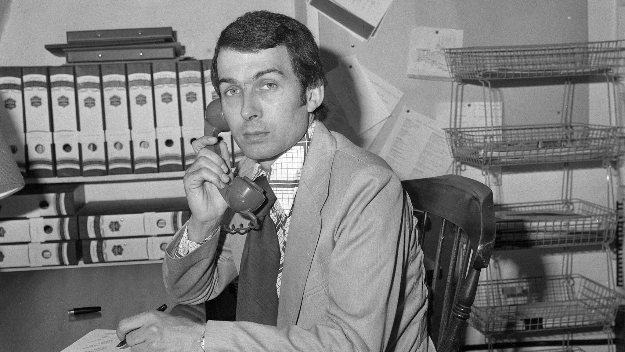 Field pictured in his office in 1976 on the telephone