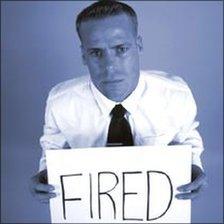 Man holds fired sign