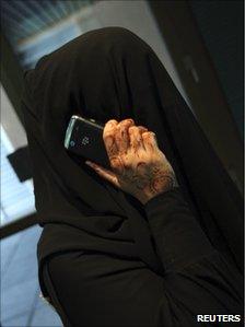 A woman talks on her mobile phone in Dubai