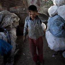 Saer al-Rashayda collects plastic from a landfill in Gaza City, July 2010