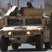 US soldiers riding in an armoured car in Afghanistan