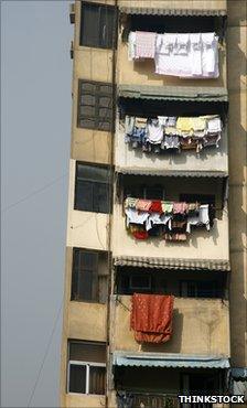Modern high-rise building in Cairo with clothes hanging out to dry from the balconies