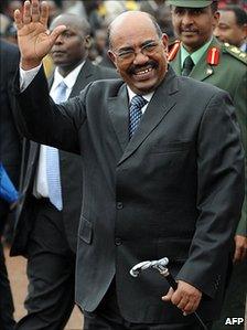 Sudanese President Omar al-Bashir waves as he arrives at the ceremony to mark the adoption Kenya's new constitution on 27 August 2010 in Nairobi