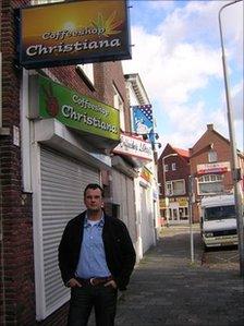 Ben van der Hoeven outside a closed coffee shop in Molenstraat, Rosendaal