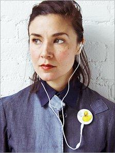Woman wearing and listening to a Playbutton album (Pic: Playbutton)