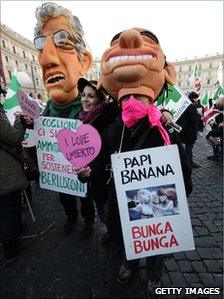 Anti-government demonstrators in Rome, with figures of Silvio Berlusconi and Umberto Bossi (Northern League leader), 11 December 2010