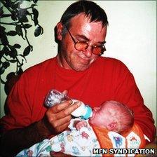 Tony Leigh with one of his grandchildren