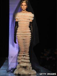 Andrej Pejic struts on the catwalk in a gown by Jean Paul Gaultier at the Haute Couture Spring/Summer 2011 show in Paris