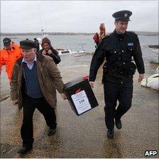 A ballot box is delivered to Inishfree Island, off the Donegal coast, 23 February